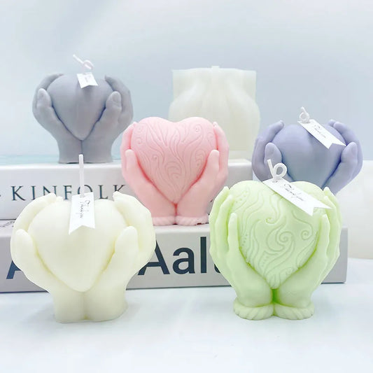 Hands Holding Heart Candle Mould