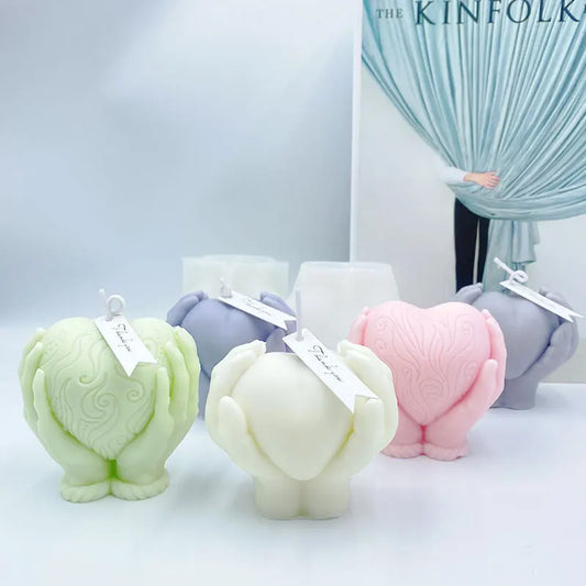 Hands Holding Heart Candle Mould