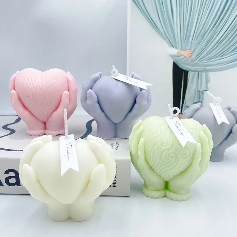 Hands Holding Heart Candle Mould
