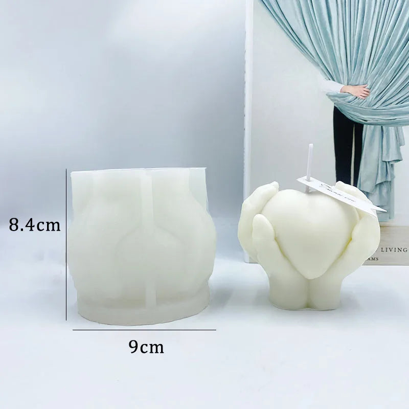 Hands Holding Heart Candle Mould