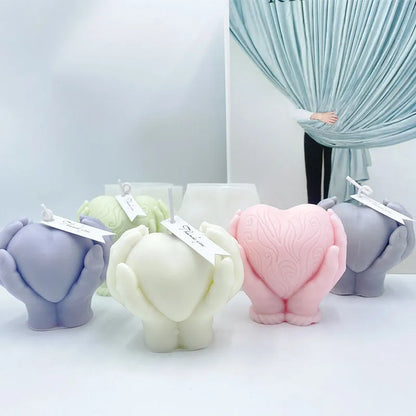 Hands Holding Heart Candle Mould