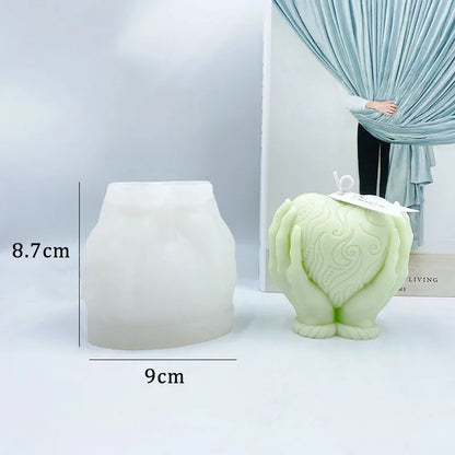 Hands Holding Heart Candle Mould